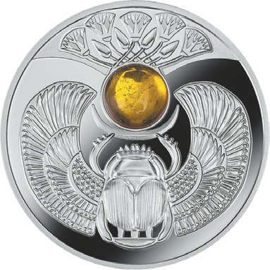 По заказу государства Ниуэ Монетный двор Польши выпустил очередную серебряную монету программы, посвященной жуку Скарабею, со вставками из натуральных камней