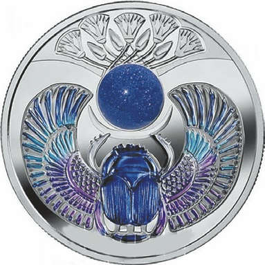 По заказу государства Ниуэ Монетный двор Польши выпустил очередную серебряную монету программы, посвященной жуку Скарабею, со вставками из натуральных камней